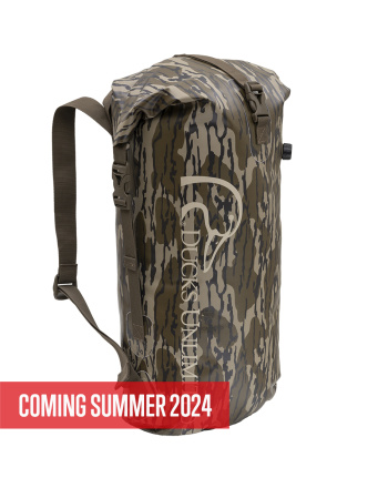 Ducks Unlimited Backpack Dry Bag - Mossy Oak® Original Bottomland® - Quarter front profile with Ducks Unlimited logo - Coming Summer 2024